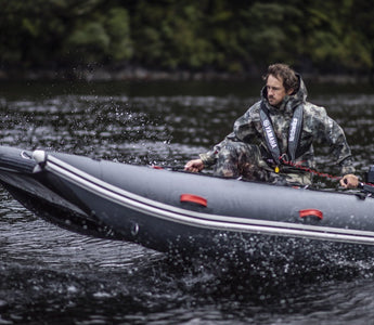 A man riding a inflatable boat