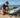 A man fixing his inflatable dinghy