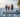 A family standing on the True Kit boat with a strong transom