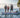 A family standing on the True Kit boat with a strong transom
