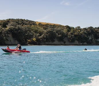 people riding an inflatable boat