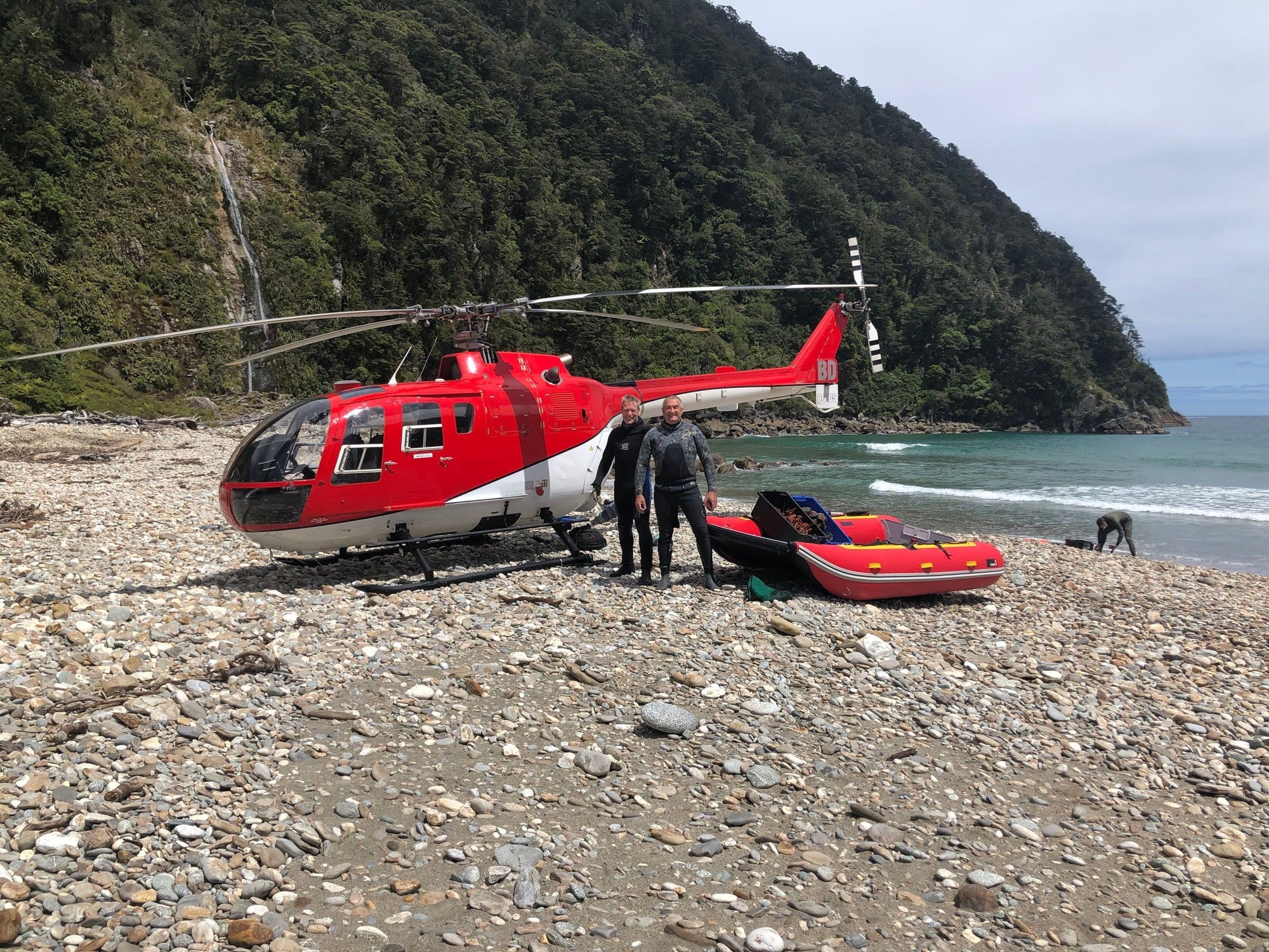 Discovery transported by helicopter to a remote South Island beach