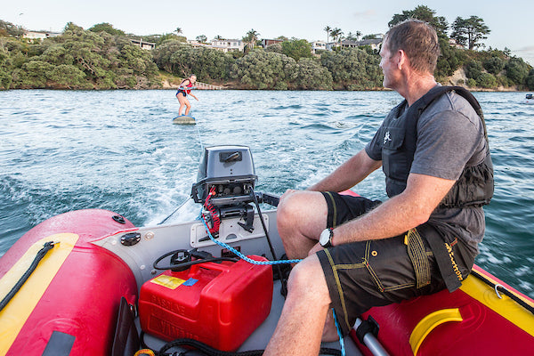 Towing a surfer behind a True Kit Discovery